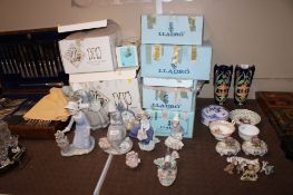 Two Nao figures with boxes, Six Lladro figures, five Lladro boxes and a spare Nao box, to include