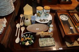 Two Portmeirion storage jars, a pottery platter decorated with a fish, a plate decorated with