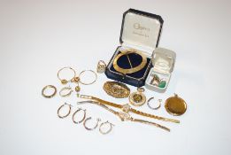 A box of various gold tone jewellery