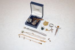 A box of assorted jewellery to include dress rings, necklaces and brooches