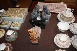 Two pairs of carved stone Dogs of Fo; a reproduction dragon seal; a Chinese style Tang horse and a