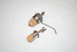 A 19th Century silver mounted bottle stopper, London 1834 and a Victorian silver mounted cherub