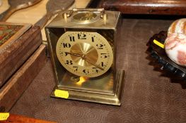 An Elliotts of London brass mantel clock with key