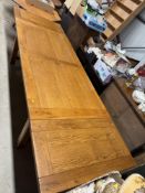 A large modern oak dining table with two extension leaves, approx. 90cm x 280cm extended x 75cm