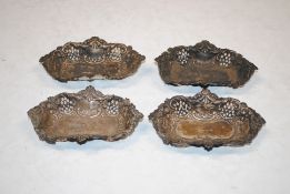 Four pierced silver dishes AF, 67.5gms total weight