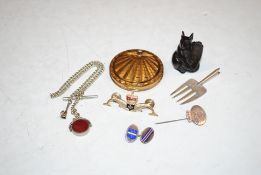 An enamel decorated RAF compact; a silver and enamel decorated single cuff-link; a white metal stick