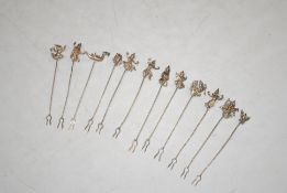 Twelve Eastern white metal pickle forks, 21gms total weight