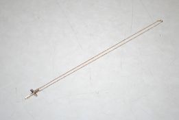 A 9ct gold crucifix pendant hung to a 9ct gold chain, 1.8gms total weight