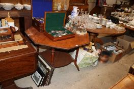 An octagonal topped centre table raised on ring turned supports united by a under tray