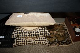 Three decorative cushions decorated with dogs and a similar decorated panel