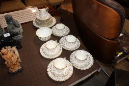 A quantity of Crescent & Sons teaware decorated with roses and turquoise dots with gilt