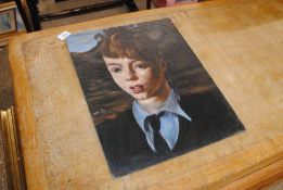 An unsigned oil on board portrait study of a young boy