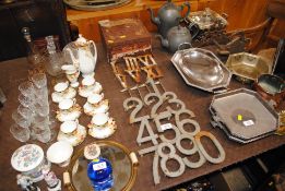 A collection of cast iron clock golf numbers