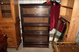 A Globe Wernicke sectional bookcase, the upper section glazed door AF
