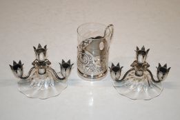 A pair of Edwardian Continental silver plated dwarf candelabra with glass bases and a Continental