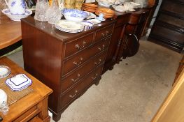 A reproduction mahogany media unit in the form of a chest of drawers