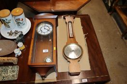 A mahogany cased wall clock and a Comitti of London barometer