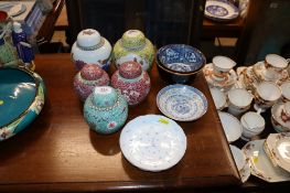 A collection of Oriental ginger jars and covers; Oriental blue and white bowls and plates