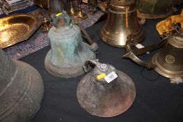 A bronze bell, 21cm high and another smaller bell