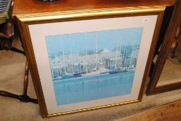 A large gilt framed print depicting a harbour scene