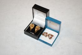 A pair of modern 9ct gold earrings, 2.6gms and a pair of unmarked tri coloured quarter hoop earrings