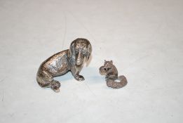 A cast silver model of a squirrel, 23gms and a white metal model of a Dachshund indistinctly
