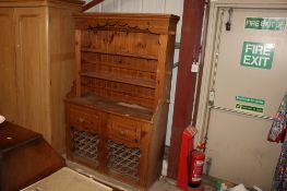A pine kitchen dresser fitted two drawers