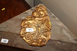 A gilt possibly olive wood carving in the form of Madonna and Child