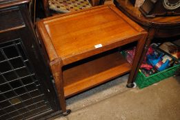 An oak Art Deco style two tier tea trolley