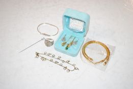 A 925 silver buckle bangle; a 925 silver ring, 23gms total weight; a necklace, bracelet, pair of
