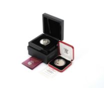 A 1996 Her Majesty Queen Elizabeth II 70th Birthday silver proof crown; and a 2013 Britannia