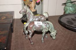 A pair of bronze horses