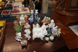 Two Beswick model dogs; various other dog ornaments; a pair of blue and white figural decorated