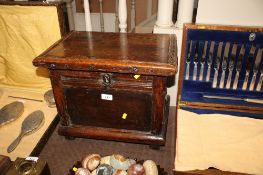 An antique oak box of small proportions, approx. 36cm wide x 31cm deep x 38cm high