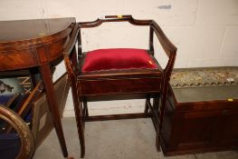 An Edwardian mahogany piano stool