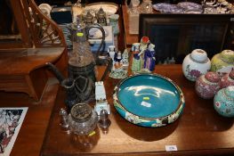 A Phoenix ware floral decorated bowl; two Staffordshire figures; a City of London crested model;