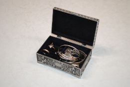 A trinket box and contents of costume jewellery and dress rings