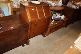 An oak bureau fitted two drawers