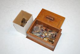 A wooden trinket box containing a 9ct gold and platinum ring, lacking stone, 1.8gms; an 18ct gold