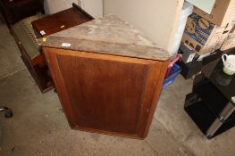 A mahogany hanging corner cupboard
