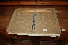 A folio containing various Japanese prints