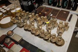 Six brass candelabras