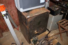 A large metal safe with key