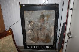 An antique 'White Horse' painted pub sign