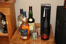A collection of various alcohol to include Remy Martin Cognac in original box, vodka, Glen Moray