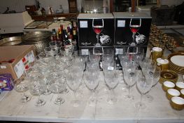 A collection of Luigi Bormioli wine glasses in original boxes together with a collection of glass