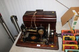 A Jones 137239 sewing machine in fitted wooden case