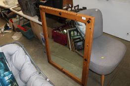 A pine framed wall mirror