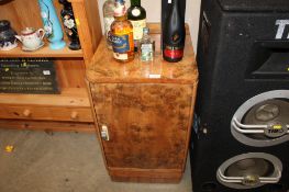 An Art Deco style walnut veneered bedside cabinet