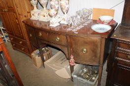 A mahogany bow front sideboard fitted central drawer